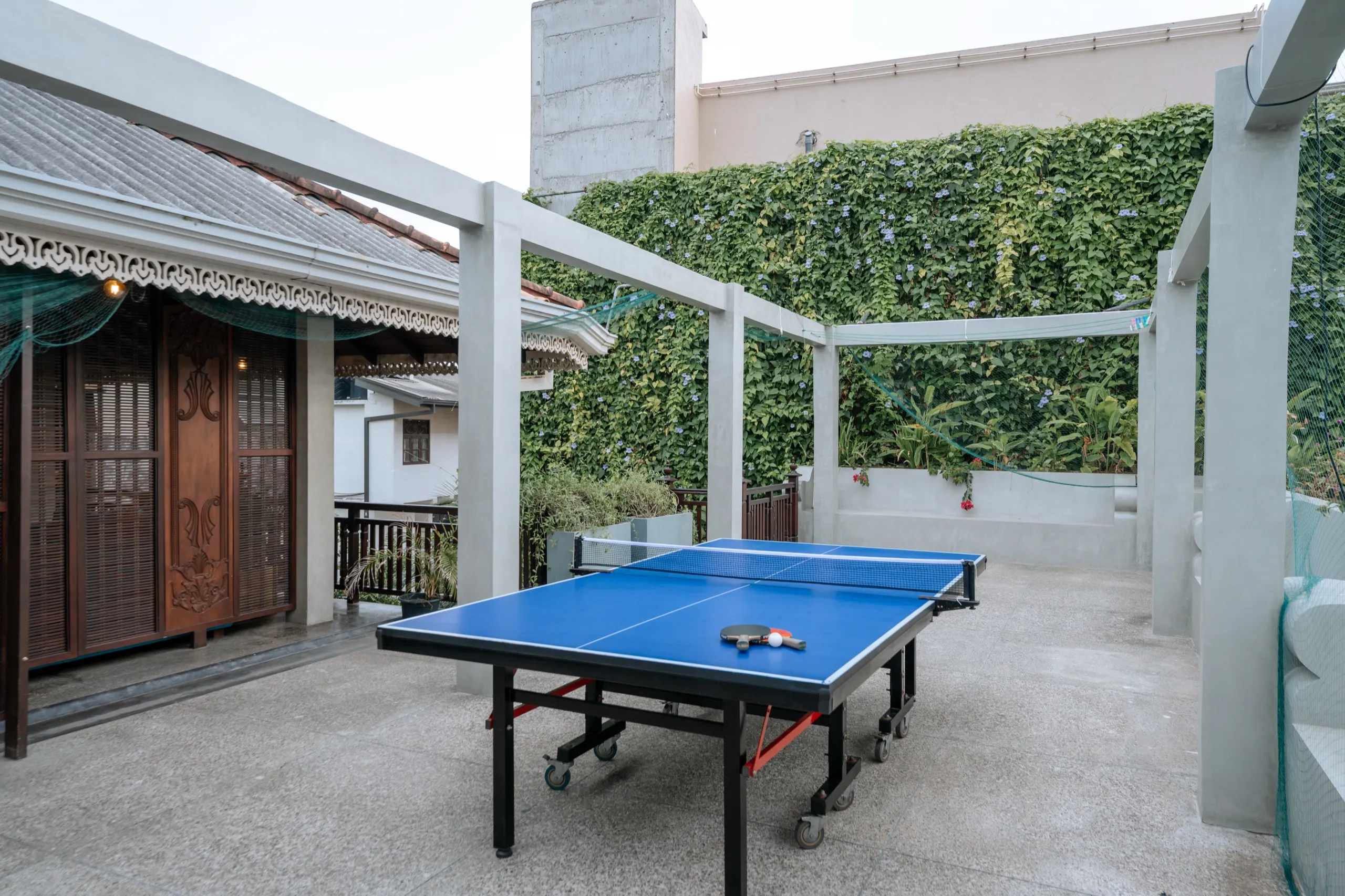 The table tennis table on the restaurant floor
