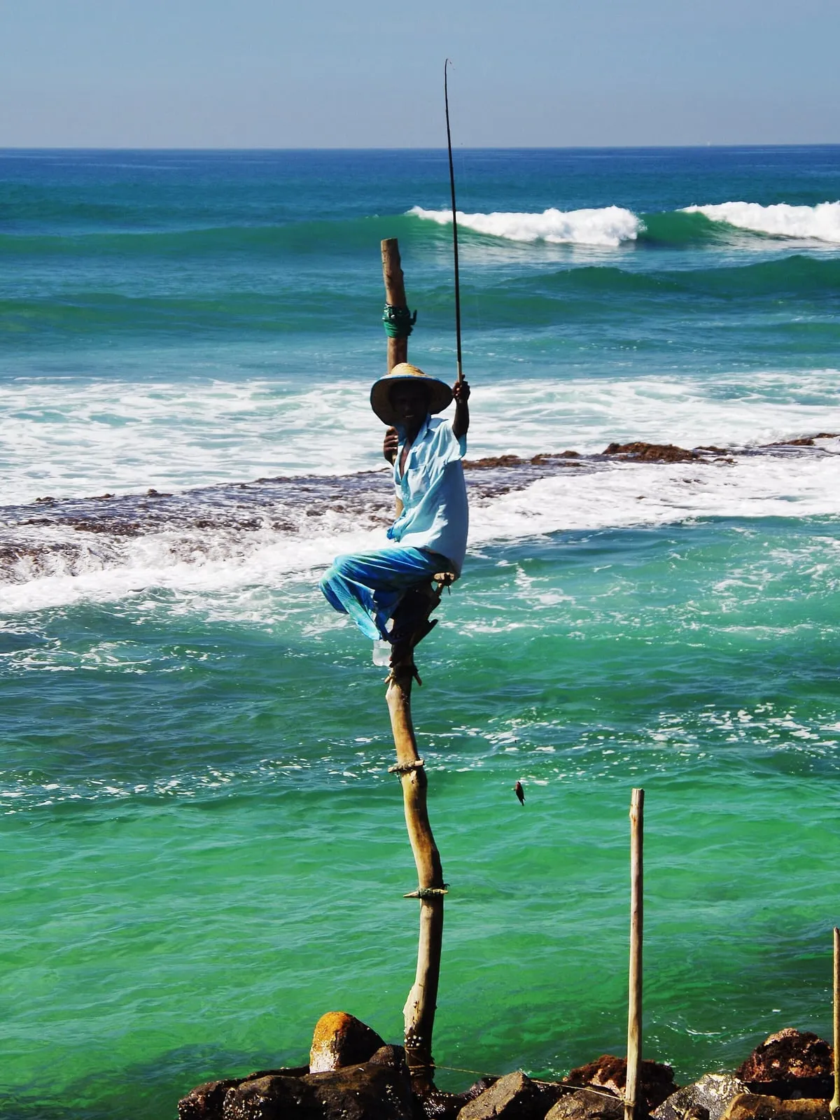 A stilt fisherman on his pole off the Weligama shore